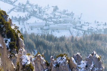 Beautifully sun lit mountains covered in snow with Ettal abbey in background