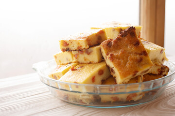 Cottage cheese casserole with raisins filling.