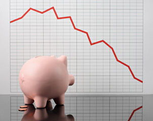 piggy bank despairing over bad financial report