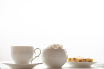 Homemade biscuits and a cup of tea on the table in the morning.