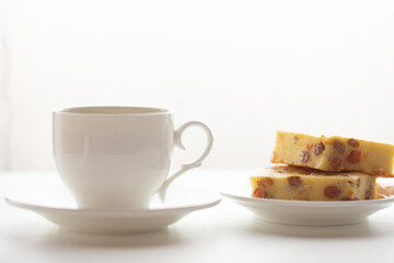 Homemade biscuits and a cup of tea on the table in the morning.