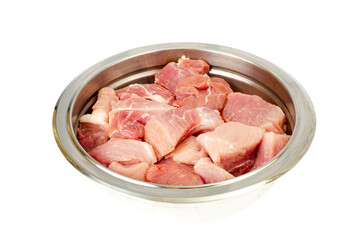 Chunks of fresh raw meat in metal bowl on white background. Studio Photo