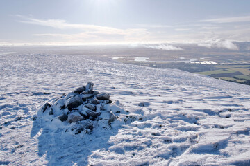 View of Forth Valley from a peak of snow covered Ochil Hills in Scotland © Jitka