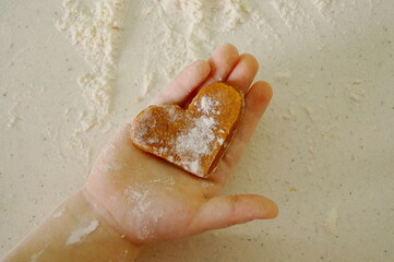 children's hands make cookies from dough