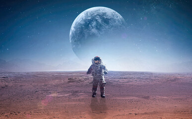 Spaceman on surface of red planet. Astronaut at space. Planet on background. Landscape of other...