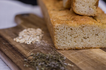 Rustic homemade bread made from rosemary and oats. Healthy homemade bread recipe. 