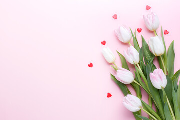 Fototapeta na wymiar Pink tulips bouquet and hearts
