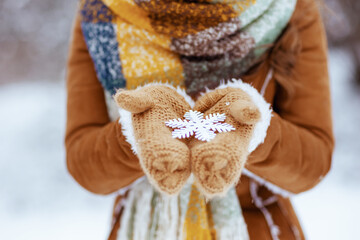 Closeup on woman outdoors in city park in winter