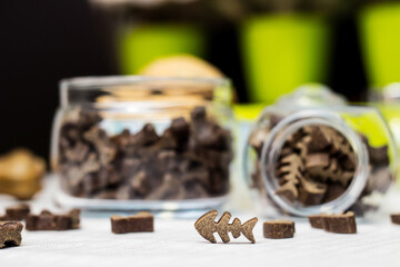 Dog treats spilling out of bowl. Dog treats and biscuits