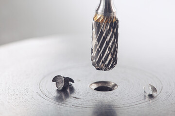 Milling сutter make sink in hole in steel billet. Locksmith work.