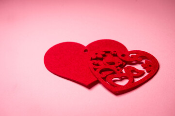 Valentine's Day. The heart lies on a pink surface. Heart on a pink background. Love symbol. Love.