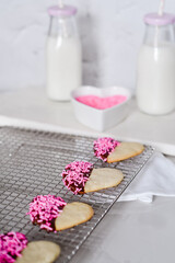 Fototapeta na wymiar Heart-Shaped Cookies with Chocolate and Candy