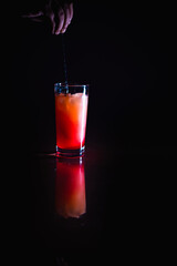 The preparation of sunrise cocktail to celebrate new year eve