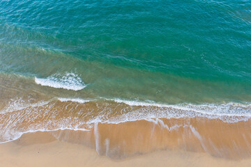 Aerial images of azure sea meets golden sand at one of Cornwall’s tourist beaches