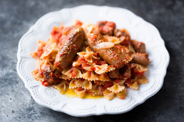 italian sausage farfalle pasta in tomato sauce