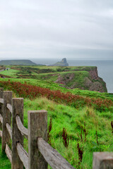Fototapeta premium Cliffs along the Gower Peninsula, Wales. Beach cliffs and sea. 