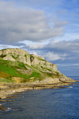 Cliffs along the Gower Peninsula, Wales. Beach cliffs and sea. 