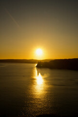 Fototapeta premium Beautiful Three Cliffs Bay at sunset, the Gower Peninsula, Wales. Beach at sunset with hills. 