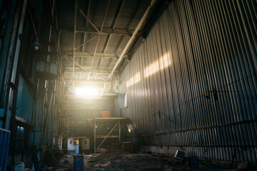 Large creepy industrial warehouse inside view of abandoned factory.