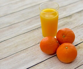 Fresh oranges and organic hand squeezed orange juice. Concept simple whole food, fresh fruit background close-up with copy space photo isolated ingredient