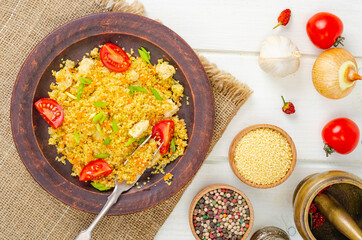 Healthy food. Couscous with chicken and vegetables. Studio Photo