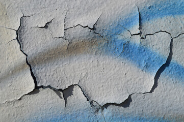 cracks, graffiti, peeling,white