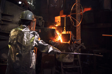 Working in foundry with hot liquid steel.