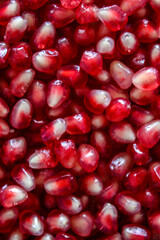 Close up of pomegranate seeds. Vertical view. Pomegranate. Seeds.