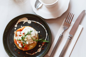 Smoked salmon sandwich with cream cheese on plate close-up