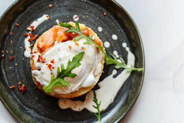 Smoked salmon sandwich with cream cheese on plate close-up