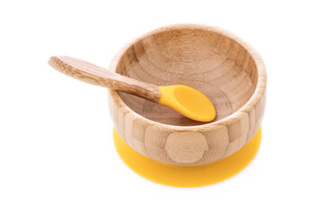 Wooden bowl. Bamboo plate with spoon isolated on white background