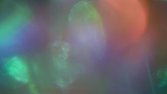 Magical flare holographic background. Seamless footage.