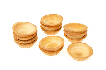 Empty sand tartlets isolated on white. Studio Photo