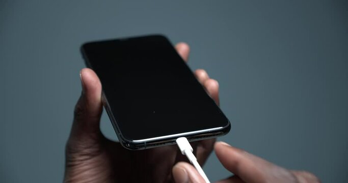 Phone 11 pro is charged with a charging cable
