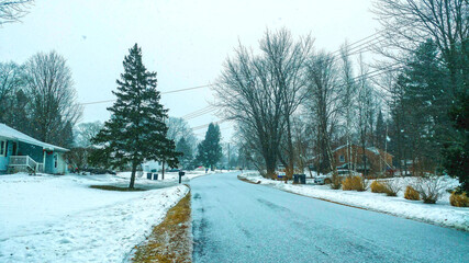 Suburban winter street in snow storm