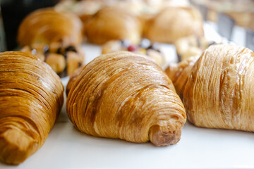 fresh croissants on counter close-up