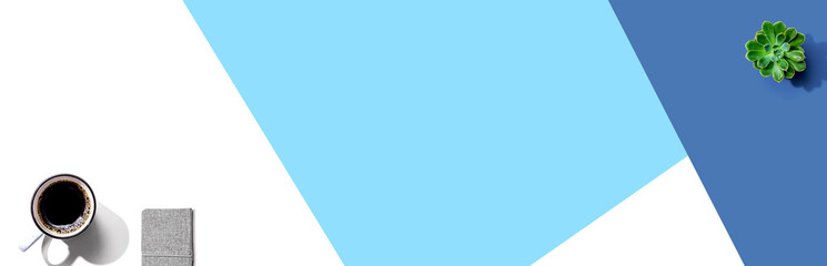 A cup of coffee and a notebook - flat lay