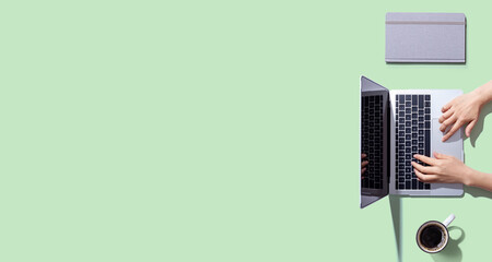 Person using a laptop computer from above