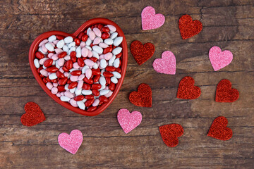 Candy coated sunflower seeds, red, pink, and white, in a heart shaped ceramic dish, Happy Valentines Day
