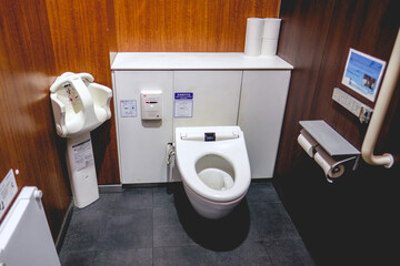 Traditional wc with washing technology in a public toilet, Japan