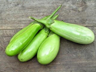 Eggplant, aubergine or brinjal on wooden background