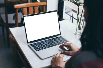 computer screen blank mockup.hand woman work using laptop with white background for advertising,contact business search information on desk at coffee shop.marketing and creative design