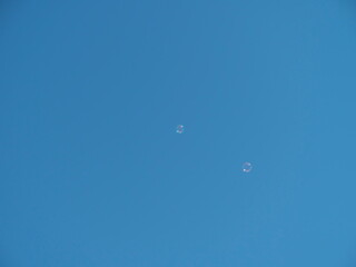 Tokyo,Japan-January 31, 2021: Bubbles flying on blue sky
