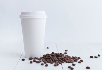 Coffee beans and paper cup
