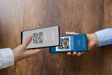 QR code payment, online shopping, E wallet, cashless technology concept. Human hand paying with qr...