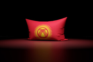 3d illustration of rectangular pillow depicting the national flag of Kyrgyzstan under red light on...