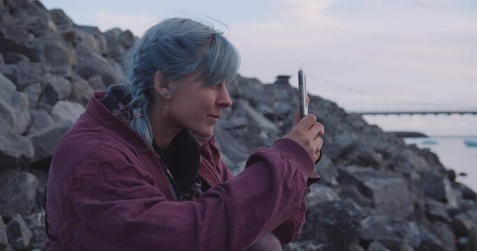 Cool Young Woman Filming Icebergs With Phone