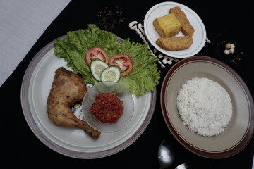 Tofu, tempeh and fried chicken are ready to be served