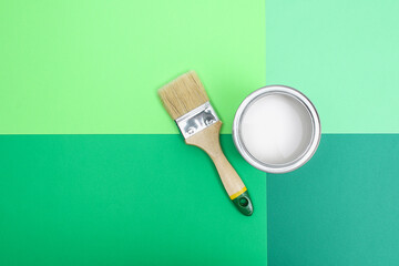 Open paint enamel cans on color palette samples. The concept of repair, construction. Shades of...