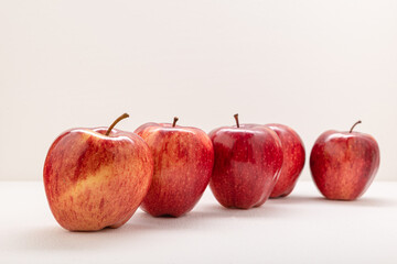 Apples are red-yellow, juicy on a light background